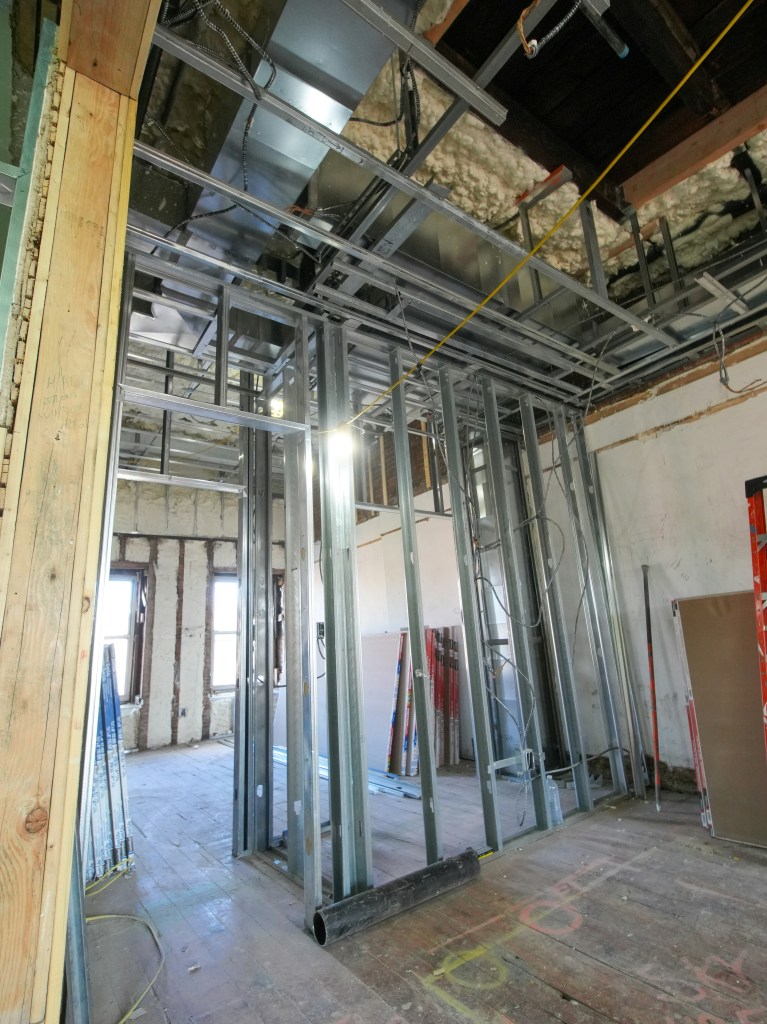 Metal stud partition framing for drylining installation